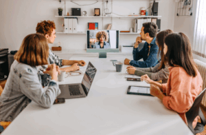 a team meets in a hybrid office space to collaborate on a project