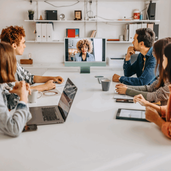 a team meets in a hybrid office space to collaborate on a project